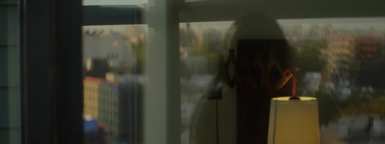 The reflection of a woman in a window