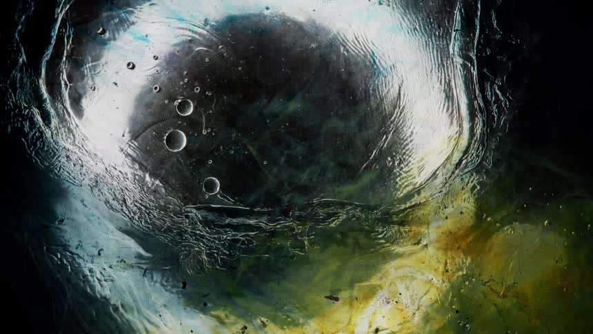 Yellow white and black colors that look like water and ice