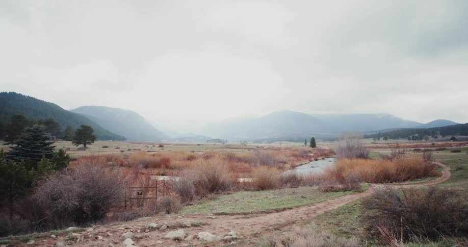 The mountains in the distance are covered with fog