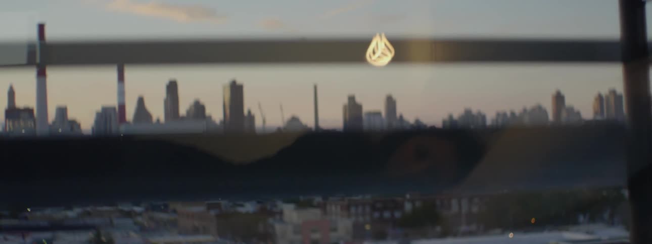 Viewing a city at sunset through window blinds