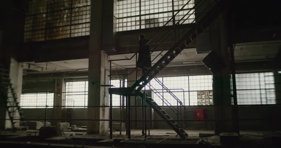 A woman walking down stairs