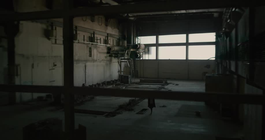 A person walking through an abandoned building