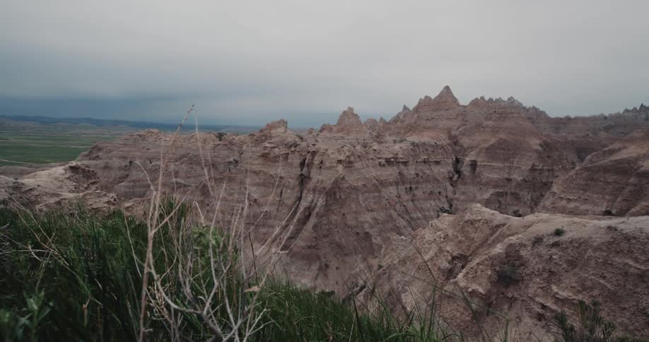Jagged rock formations in a canyon in the wilderness on cloudy day