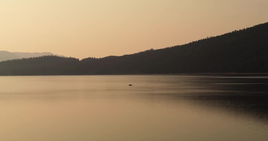 A boat is in the water in the distance
