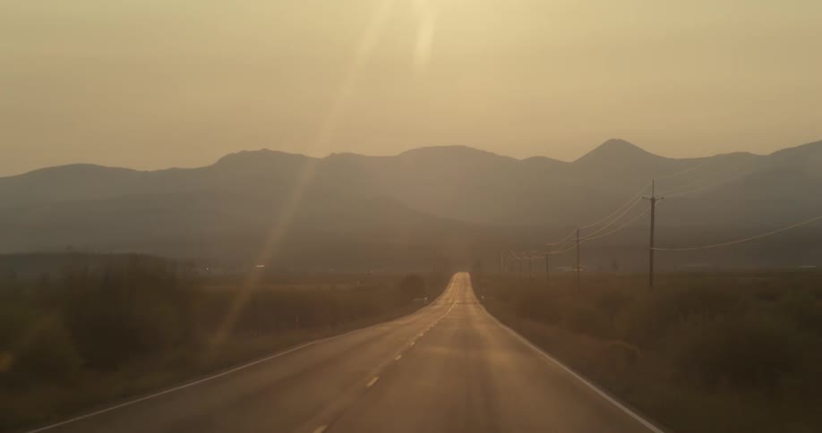 Fog is covering the road and mountains