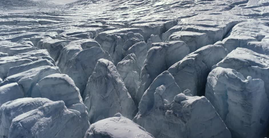 Tall glaciers form peaks and valleys made of ice and compacted snow