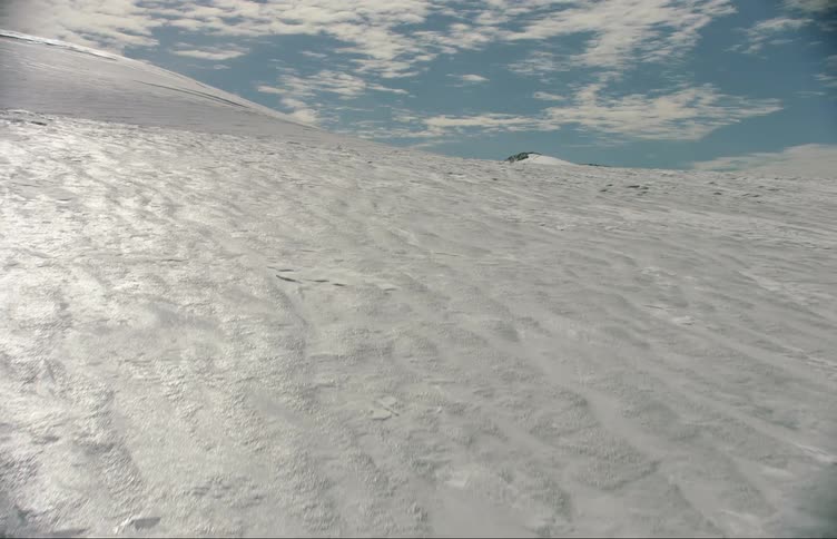 The hills and mountain are covered with ice