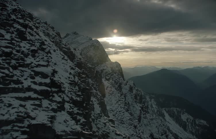 The sun is rising over the mountain range