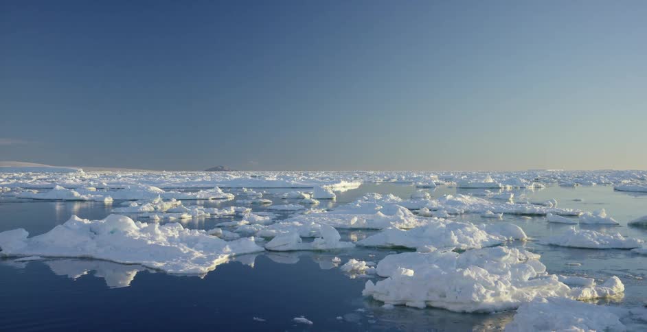 A body of water filled with chunks of ice