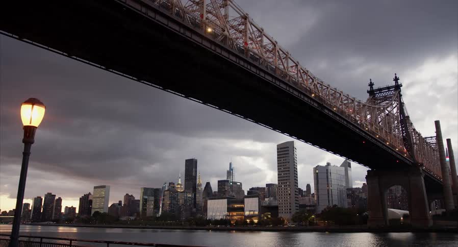 A view of a city with a bridge leading into it