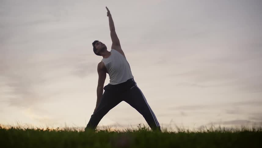 A man stretching and exercising outdoors