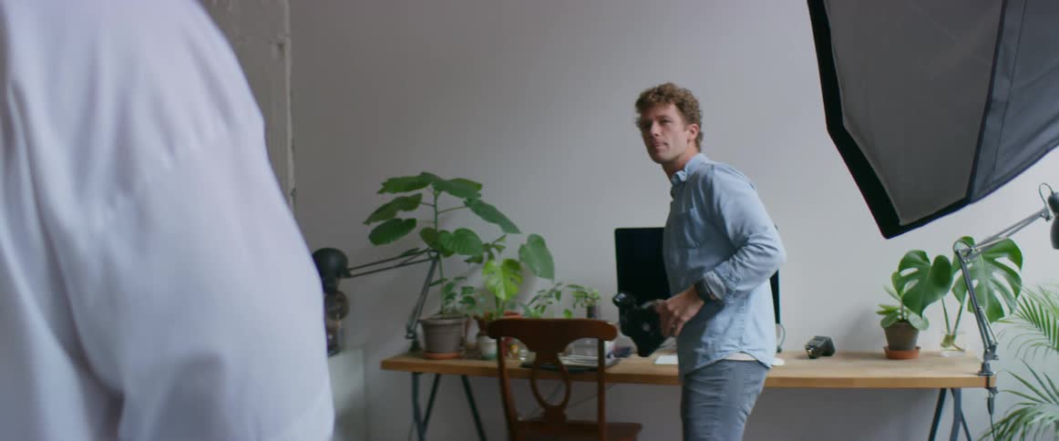 A photographer is taking photos in the studio