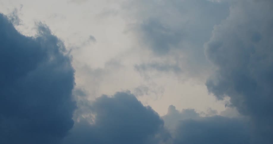 Dark storm clouds move across the sky closing in on a break