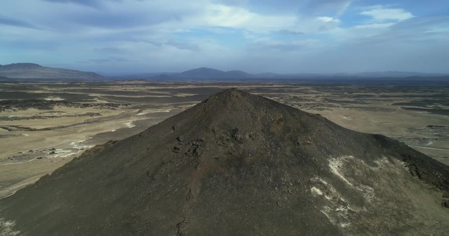 An aerial view of a hill in the desert