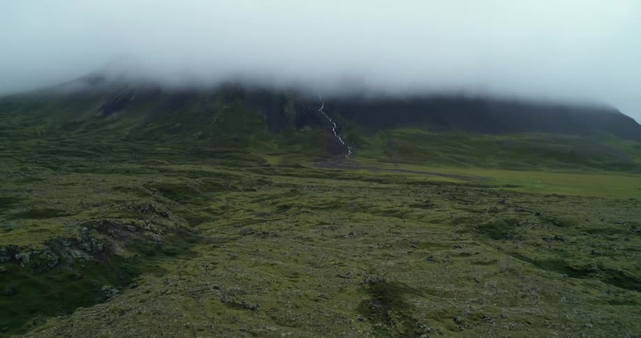 A landscape with a river with a mountain range the sky and clouds in the background