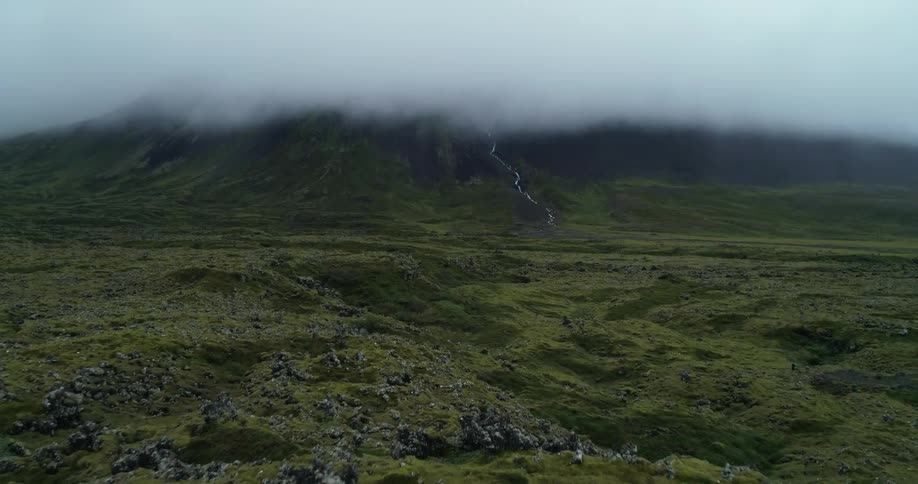 A landscape with a river with a mountain range the sky and clouds in the background