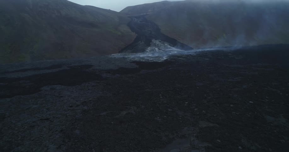 A landscape with rocks and smoke with the sky and clouds in the background