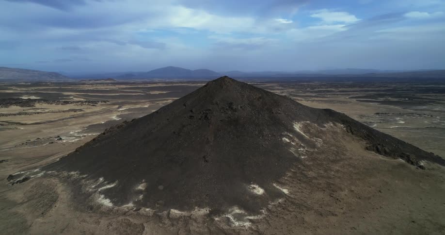 An aerial view of a mountain in the desert