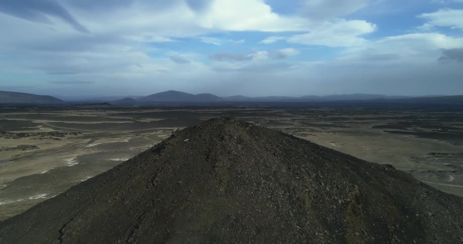 An aerial view of a mountain in the desert