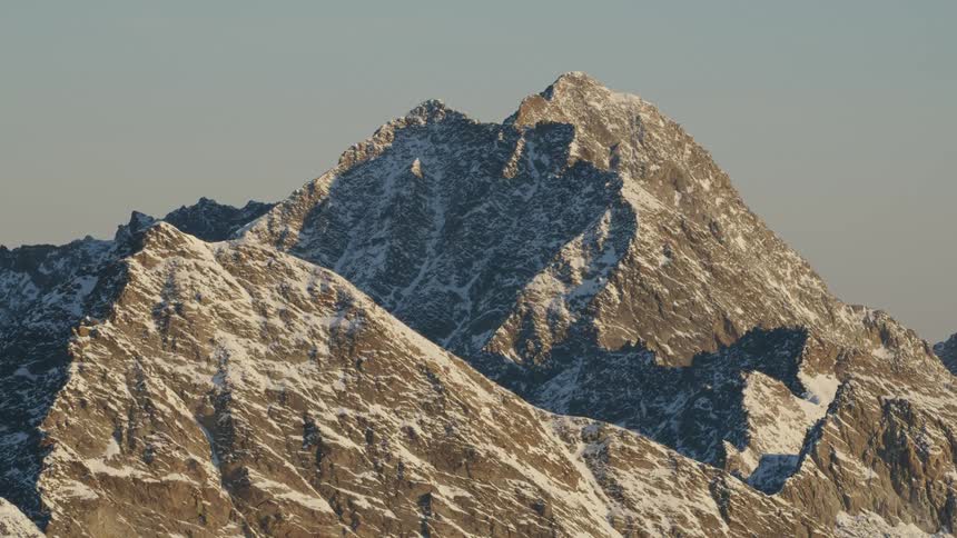 A snow dusted rocky mountain peak