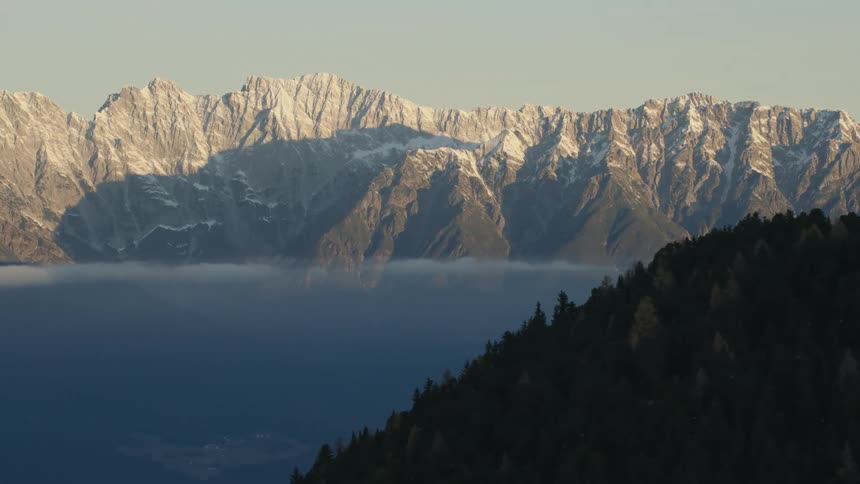 An aerial view of mountains covered in sow