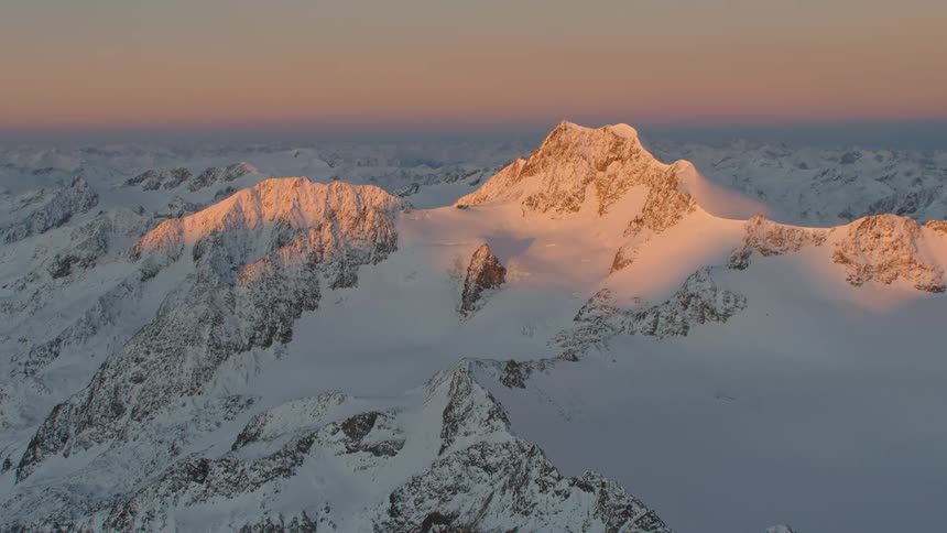 Helicopter Hyperlapse of a sunset in the alpine mountains