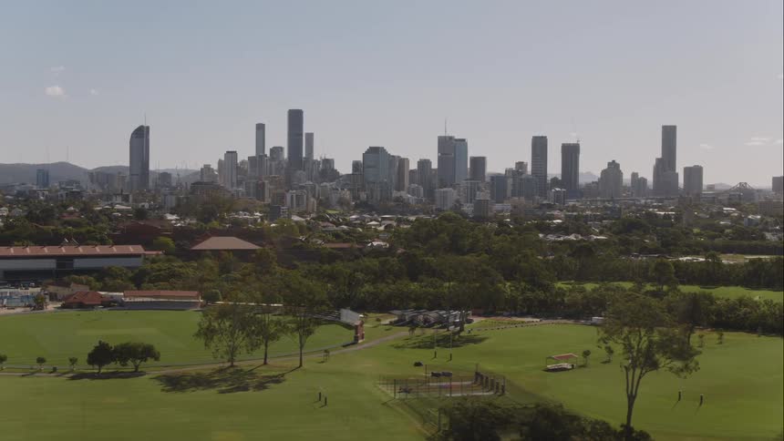 Aerial view of city park and city skyline with tall buildings