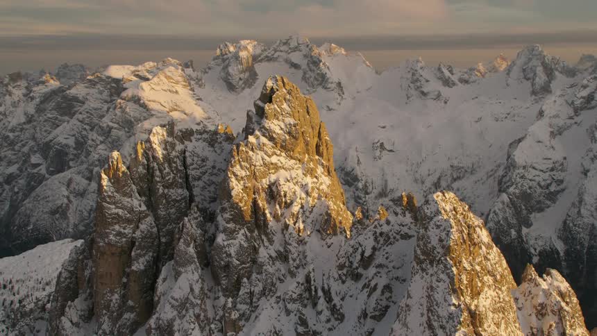 The tall mountains are covered with snow