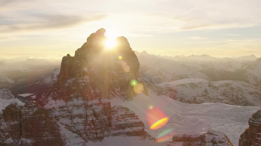 An aerial view of mountains covered in snow