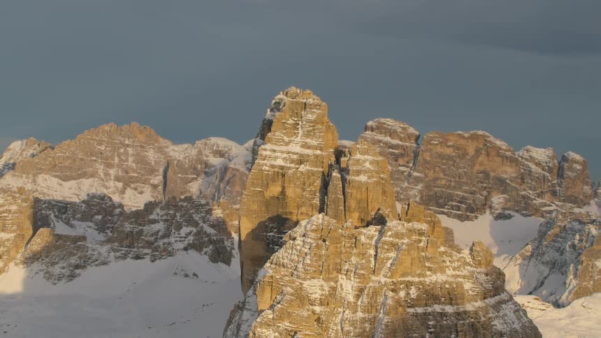 An aerial view of mountains in snow