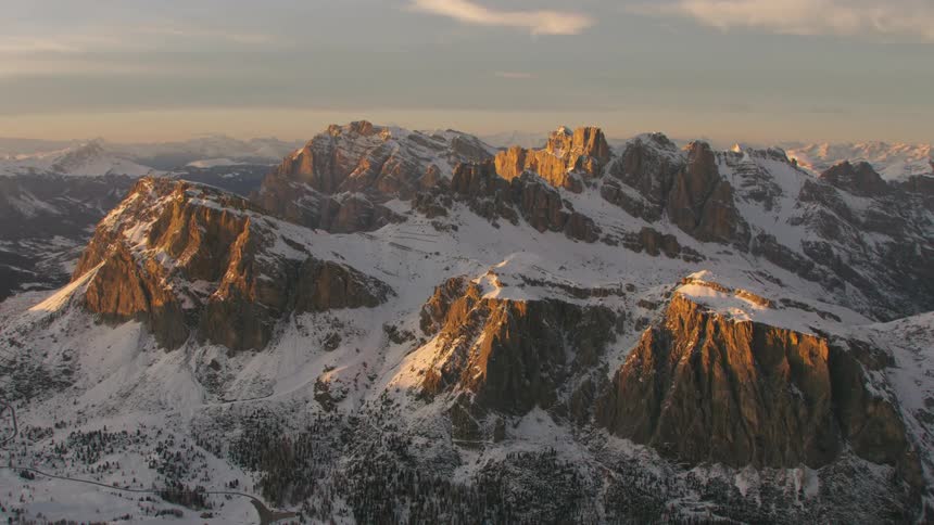 An aerial view of a snow covered mountain range