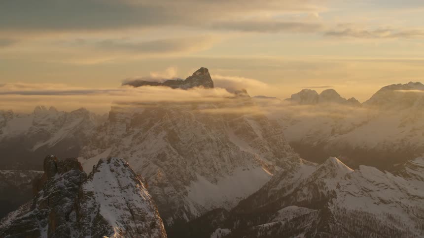 The sun is rising on the mountain range