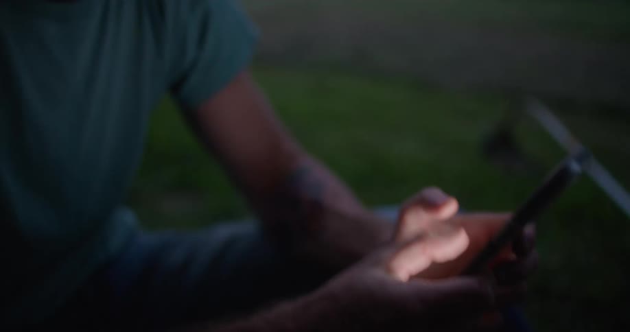 A person using a smartphone outdoors