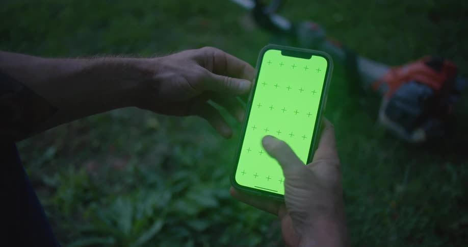 A person using a smartphone outdoors