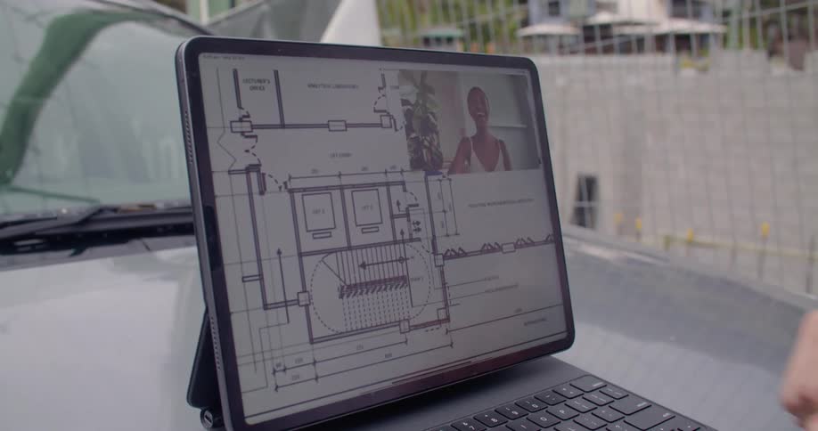 A tablet sitting outside with a woman talking on it