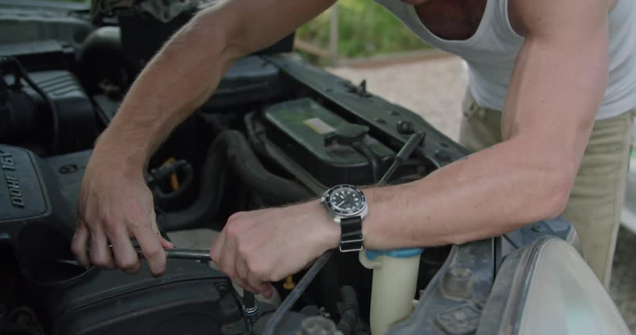 A man is working on his car