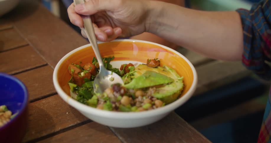 A person is eating a vegetarian meal