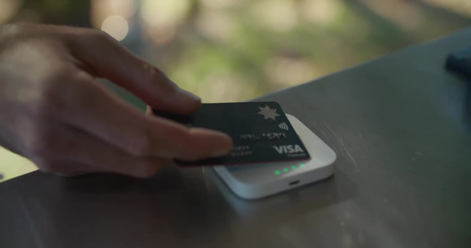 Customer pays using credit card on touch sensor