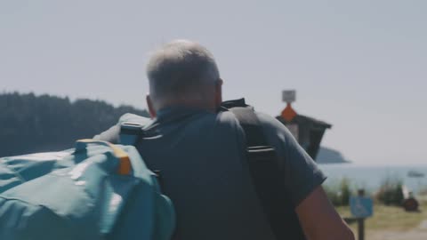 A man picks up a folded table