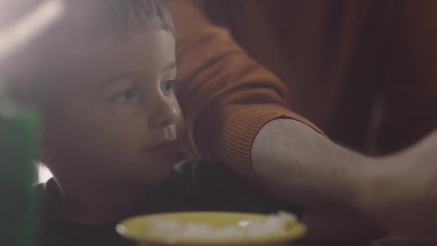 A father and son are playing a board game