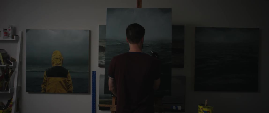 A man paints a picture of water