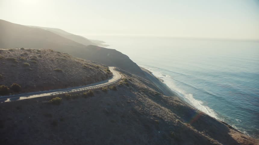 Aerial view of a road on the slope of a mountain on the coast