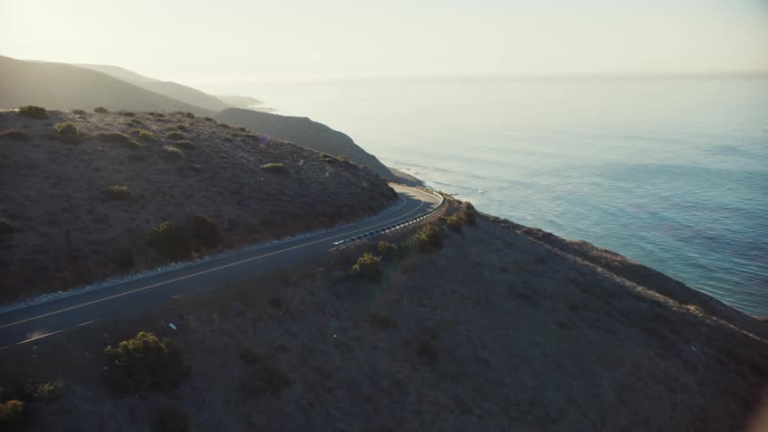 Aerial plate shot of coastal road near the sea