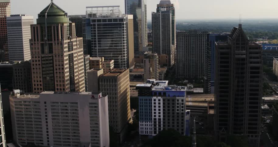 An aerial view of a downtown section of a large city in the daytime