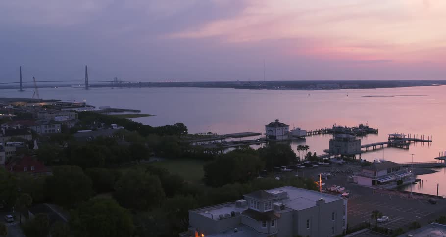 An aerial view of a coast at sunset