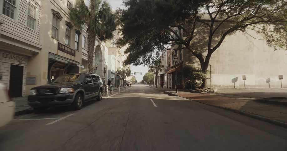 Driving on an empty street on a small city at morning