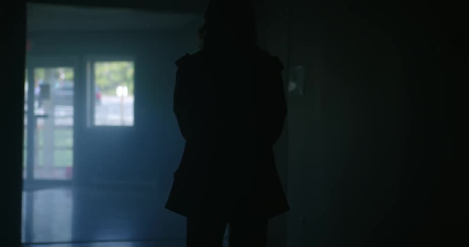 Female standing indoors