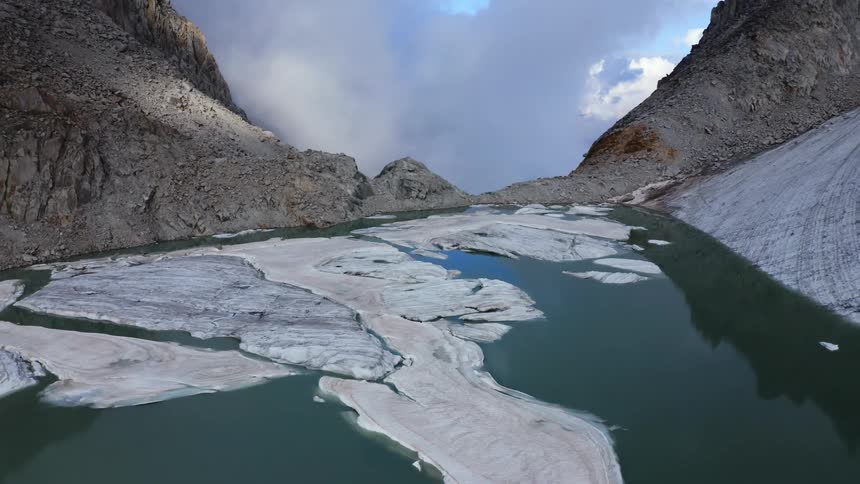A small lake is at the top of the mountain