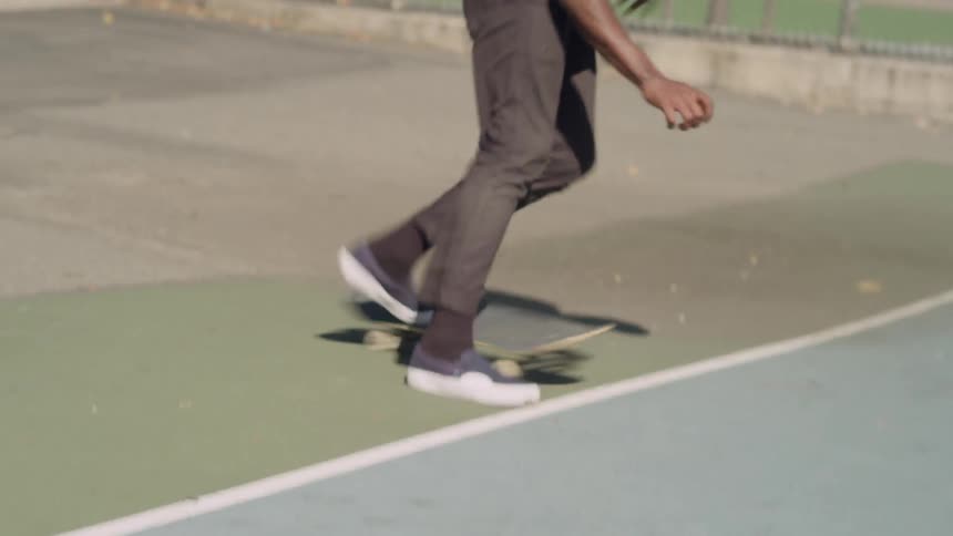 A man does a jump on a skateboard