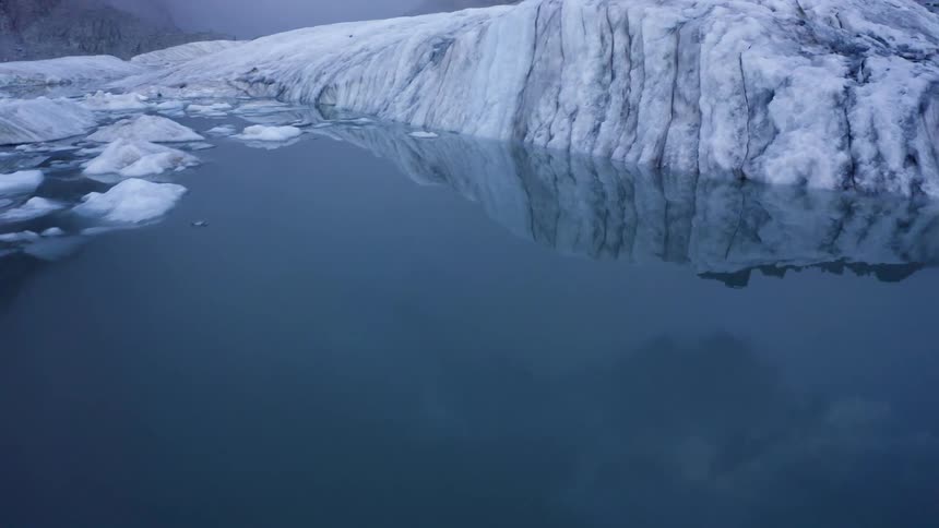 The ice is reflecting on the water